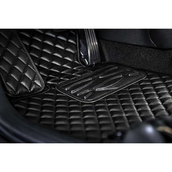 Eko ādas paklājiņi QuiltyMats VOLKSWAGEN T5 CARAVELLE 2003-2015g. (I, II un III eilės un bag., prailginta 8v.) (Melna / melnas šuves)